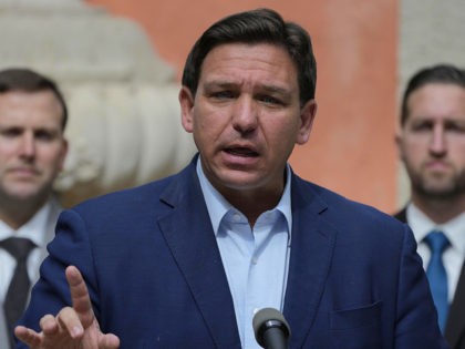 FILE - Florida Gov. Ron DeSantis speaks during a news conference, Feb. 1, 2022, in Miami. Gov. DeSantis has signed a COVID-19-linked bill requiring health care centers to allow in-person visitations, as the Republican announced he approved dozens of other measures passed during this year's legislative session. (AP Photo/Rebecca Blackwell, …