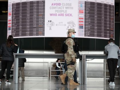 NEW YORK, NY - APRIL 19: A New York Army National Guard soldier walks around John F. Kennedy Airport on April 19, 2022 in New York City. On Monday, a federal judge in Florida struck down the mask mandate for airports and other methods of public transportation as a new …