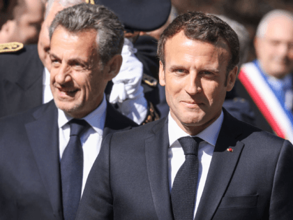 French President Emmanuel Macron (R) and his predecessor Nicolas Sarkozy arrive for a ceremony in tribute to World War II resistance fighters killed at the plateau des Glieres on March 31, 2019 at the Necropole de Morette military cemetery in Thones, French Alps. (Photo by ludovic MARIN / POOL / …
