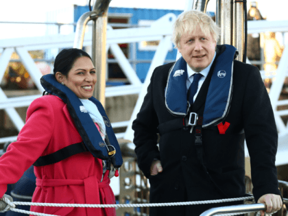 SOUTHAMPTON, ENGLAND - DECEMBER 2: Britain's Prime Minister Boris Johnson and Home Secretary, Priti Patel onboard a security vessel at the Port of Southampton, Britain December 2, 2019. (Photo by Hannah McKay - WPA Pool/Getty Images)