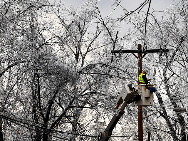 A worker repairs power lines as winter storm brings havoc to New Jersey as ice caused power outages and downed trees throughout the area on December 18, 2019 in West Orange, New Jersey. Temperatures are expected to be in the teens by Thursday morning. (Photo by Rick Loomis/Getty Images)