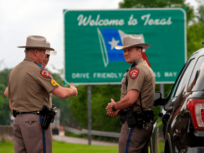 Texas State troopers patrol I-10 across the border from Louisiana on March 30, 2020 in Orange, Texas. - Texas governor Greg Abbott expanded an executive order on March 29 that requires travelers that come into Texas by road from Louisiana to self-quarantine. (Photo by Mark Felix / AFP) (Photo by …