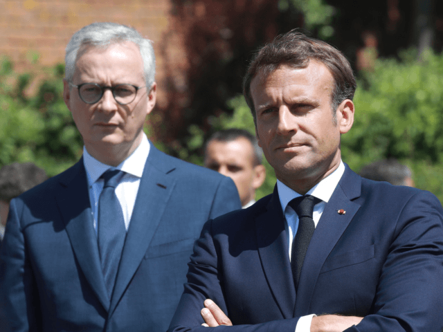 French President Emmanuel Macron (R) arrives with French Economy Minister Bruno Le Maire t