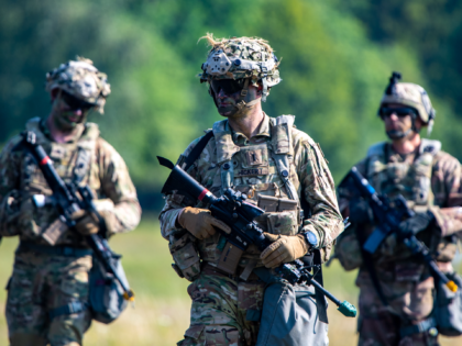 HOHENFELS, GERMANY - AUGUST 10: Soldiers of the U.S. 173rd Airborne Brigade walk down an a