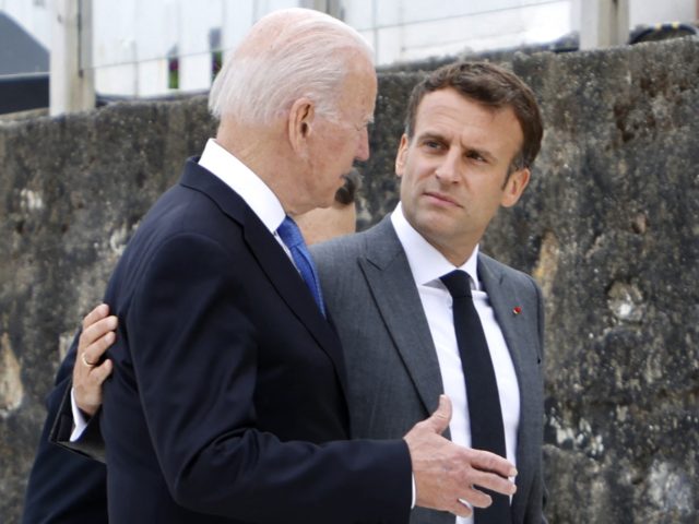 US President Joe Biden (L) and France's President Emmanuel Macron speak after the family photo at the start of the G7 summit in Carbis Bay, Cornwall on June 11, 2021. - G7 leaders from Canada, France, Germany, Italy, Japan, the UK and the United States meet this weekend for the …
