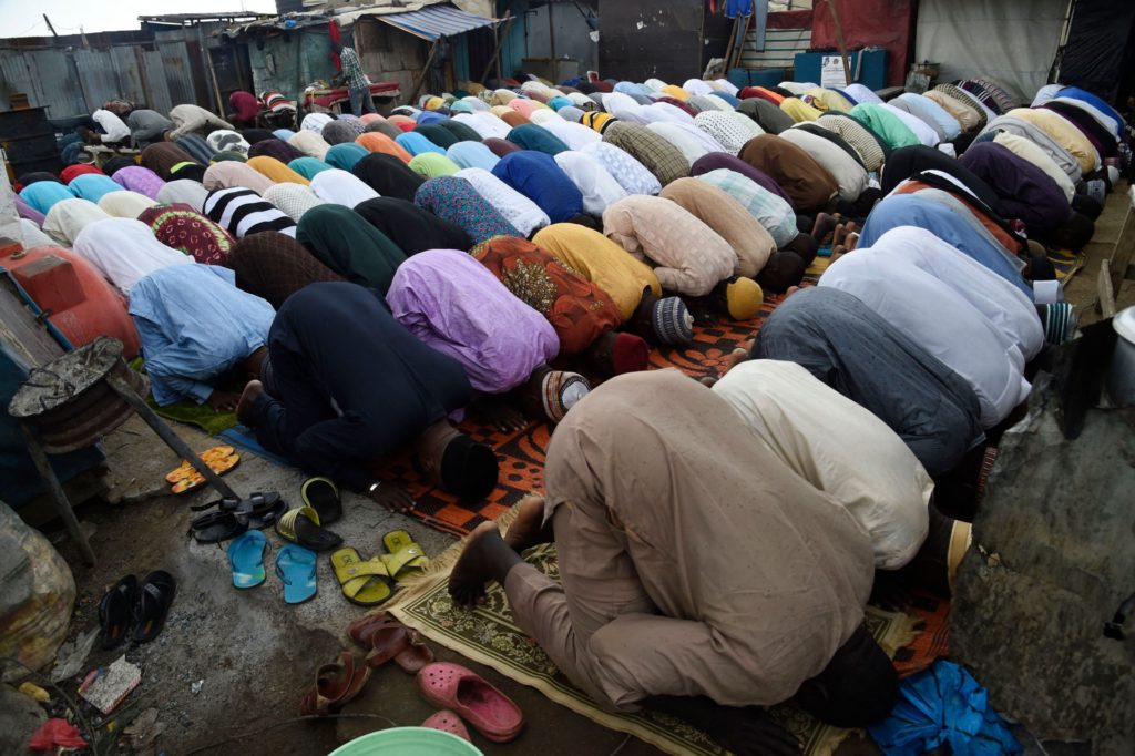 Muslims pray while ignoring restrictions and social distancing against the spread of the Covid-19 pandemic to celebrate Eid al-Adha at the Ibafo Mosque in Ogun state, southwestern Nigeria, July 20, 2021.  - Eid al-Adha, the Feast of Sacrifice is celebrated throughout the Muslim world as a commemoration of Abraham's willingness to sacrifice his son to God.  Cows, camels, goats and sheep are traditionally slaughtered on the holiest day.  (Photo by PIUS UTOMI EKPEI / AFP) (Photo by PIUS UTOMI EKPEI / AFP via Getty Images)