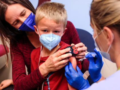 DENVER, CO - NOVEMBER 03: Jill Holm-Denoma, left, comforts her son, Tyler Holm-Denoma, 5, as National Jewish Health registered nurse Emily Cole, right, administers a pediatric COVID-19 vaccine on November 3, 2021 in Denver, Colorado. The U.S. Centers for Disease Control has approved the Pfizer-BioNTech pediatric vaccine for the 28 …