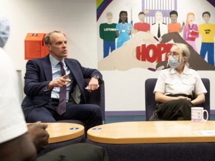 Britain's Prime Minister Boris Johnson (R) and Britain's Justice Secretary and deputy Prime Minister Dominic Raab (L) meet with Prison Wardens as they visit HMP Isis, a Category C male Young Offenders Institution in south east London on December 4, 2021. (Photo by Geoff PUGH / POOL / AFP) / …