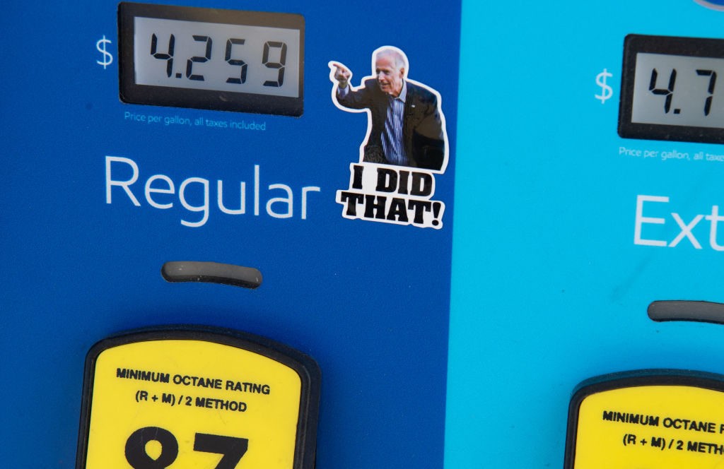 A gas pump displays current fuel prices, along with a sticker of US President Joe Biden, at a gas station in Arlington, Virginia, on March 16, 2022. (Photo by SAUL LOEB / AFP) (Photo by SAUL LOEB/AFP via Getty Images)