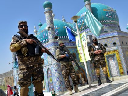Taliban fighters stand guard at the Karte Sakhi shrine on the first day of 'Nowruz' marking the Persian New Year in Kabul on March 21, 2022. (Photo by Ahmad SAHEL ARMAN / AFP) (Photo by AHMAD SAHEL ARMAN/AFP via Getty Images)