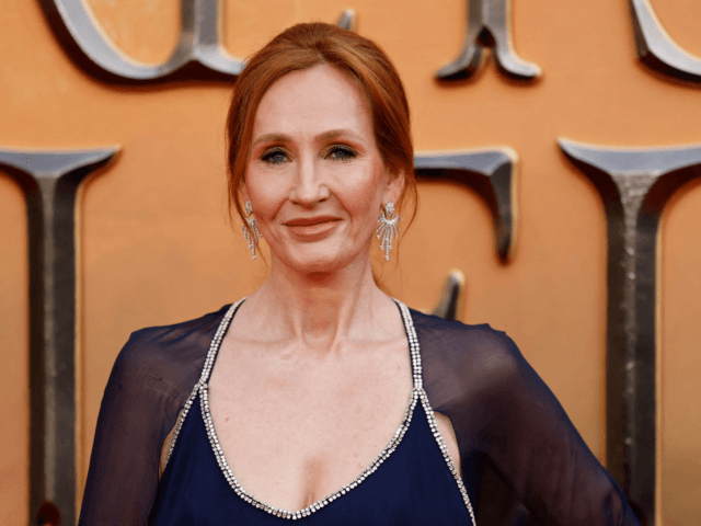 British writer J.K Rowling poses on the red carpet after arriving to attend the World Prem