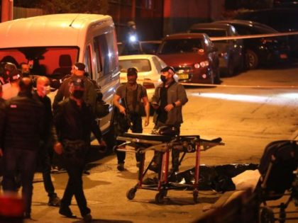 EDITORS NOTE: Graphic content / TOPSHOT - Israeli security forces and emergency personnel gather at the scene of a shooting attack on March 29, 2022 in Bnei Brak, 7km (4.5 miles) east of Tel Aviv. - Five people were killed in gun attacks Tuesday near the Israeli coastal city of …