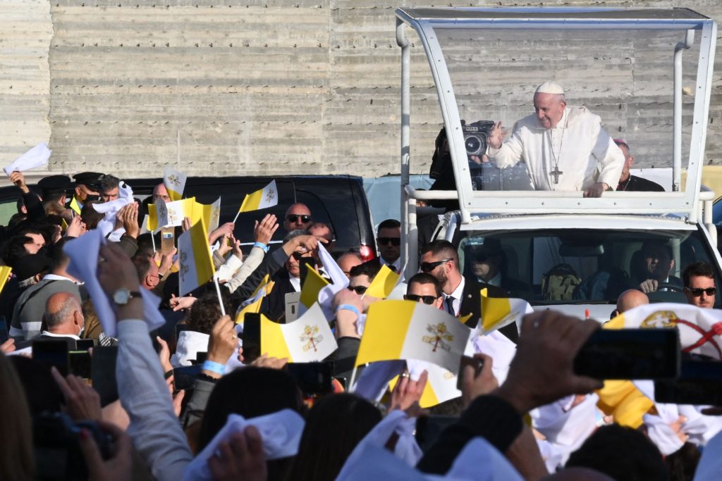 Pope Francis blesses attendees as he arrives in the popemobile car for a meeting of prayer outside the Basilica of the National Shrine of the Blessed Virgin of Ta' Pinu, in Gharb, Gozo island, Malta, on April 02, 2022, on the first day of the Pope's two-day trip to the Mediterranean archipelago. (Photo by Andreas SOLARO / AFP) (Photo by ANDREAS SOLARO/AFP via Getty Images)