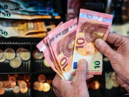 BERLIN, GERMANY - APRIL 04: In this photo illustration, A salesman counts the money in the cash register in a market on April 4, 2022 in Berlin, Germany. Inflation in Germany jumped to 7.3% in March, the highest rate in 40 years, mainly due to rising energy prices resulting from …