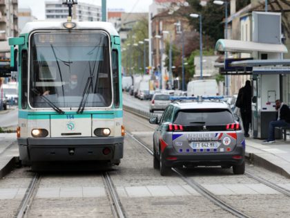 A police car drives on the tram path in Bobigny, outside Paris, on April 6, 2022, after France's President asked for "complete clarity" on the death of a young man of the Jewish faith hit by a tram in mid-February following violence, a drama which, according to him, should not …
