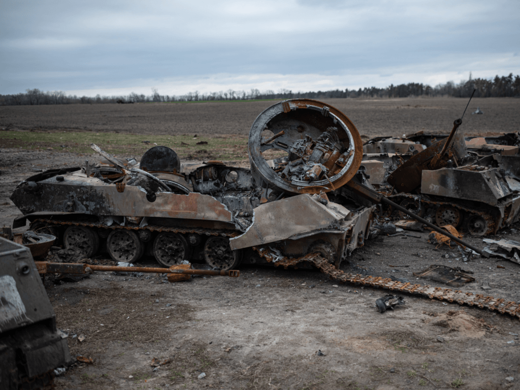 HOSTOMEL, UKRAINE - APRIL 6: Burned Russian tanks and APCs are seen in a field on April 6, 2022 in Hostomel, Ukraine.  Hostomel was occupied by Russian forces for more than a month as they advanced on the Ukrainian capital before finally retreating to Belarus last week.  (Photo by Alexey Furman/Getty Images)