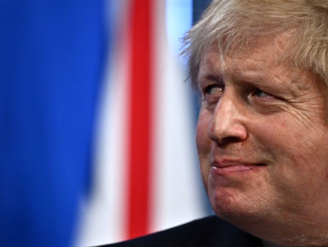 LONDON, ENGLAND - APRIL 08: Britain's Prime Minister Boris Johnson listens during a j