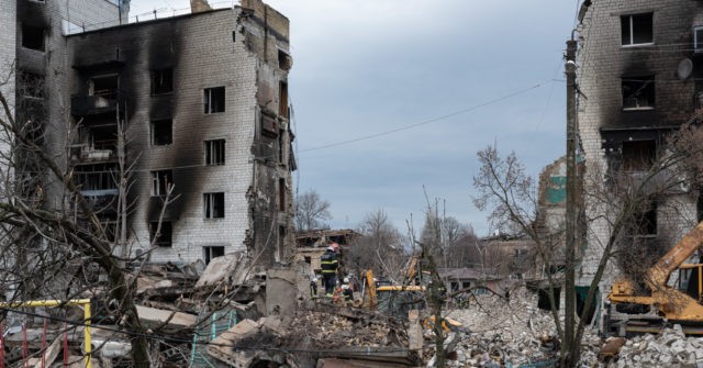 PICS: Rescuers Sift Rubble of Shattered Town Abandoned by Russians