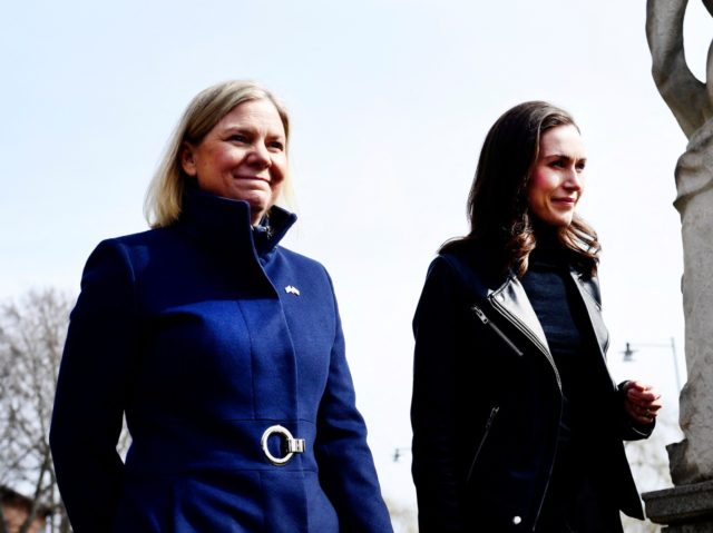 Swedish Prime Minister Magdalena Andersson (L) welcomes Finnish Prime Minister Sanna Marin prior to a meeting on whether to seek NATO membership in Stockholm, Sweden, on April 13, 2022. - Rattled by Russia's invasion of Ukraine, Finland will kickstart a debate that could lead to seeking NATO membership, a move …