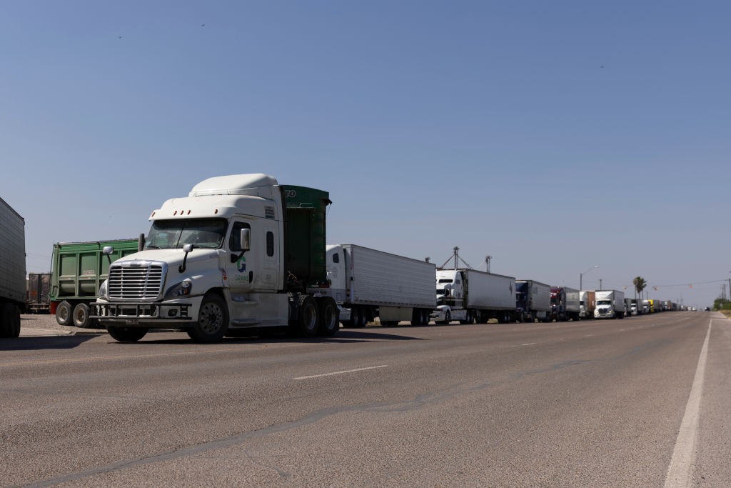 PROGRESO, TX - APRIL 13: Hundreds of commercial trucks wait in line to cross the Progreso International bridge into Mexico on April 13, 2022 in Progreso, Texas. The bridge reopened to commercial traffic after 5 p.m. after being closed since Monday because of Mexican truckers on strike. (Photo by Michael Gonzalez/Getty Images)