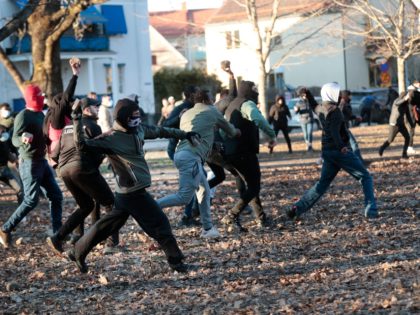 Counter-protesters throw stones in the park Sveaparken in Orebro, south-centre Sweden on A