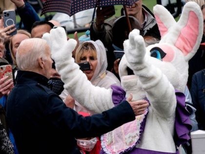 President Joe Biden gestures to the Easter Bunny during the annual Easter egg roll on the South Lawn of the White House in Washington, DC, on April 18, 2022. (Photo by Stefani Reynolds / AFP) (Photo by STEFANI REYNOLDS/AFP via Getty Images)