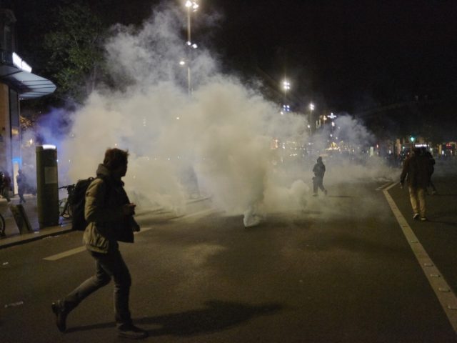 PARIS, FRANCE - APRIL 24: Police fire tear-gas at protesters of centrist incumbent President Emmanuel Macron's apparent defeat of far-right rival Marine Le Pen for a second five-year term, on Place de la République April 24, 2022 in Paris, France. Today's race is the second consecutive election Macron and Le …