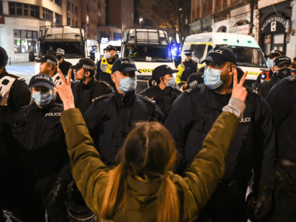 BRISTOL, ENGLAND - APRIL 03: A protester gestures in front of police officers during a Kil