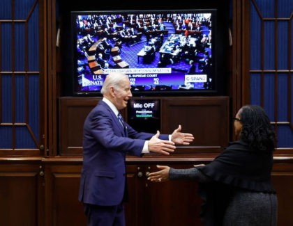 WASHINGTON, DC - APRIL 07: U.S. President Joe Biden embraces Ketanji Brown Jackson moments after the she got enough votes in the U.S. Senate to be confirmed as the first Black woman to be a justice on the Supreme Court in the Roosevelt Room at the White House on April …