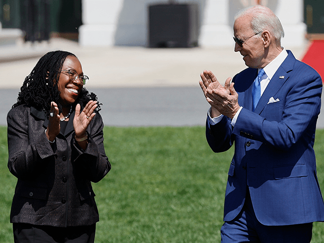 U.S. President Joe Biden applauds for Judge Ketanji Brown Jackson during an event celebrat