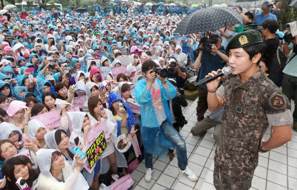 This photo taken on July 24, 2013, shows South Korean pop idol Yoon Hak being discharged from the military service in Yongin.  REPUBLIC OF KOREA OUT JAPAN OUT AFP PHOTO/STARNEWS        (Photo credit should read Starnews/AFP via Getty Images)