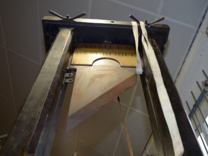 A guillotine is pictured in its auction room in Nantes, western France, on March 25, 2014. The guillotine will be auctioned on March 27, 2014 and could be sold for a price between 40.000 and 60.000 euros. AFP PHOTO / DAMIEN MEYER (Photo credit should read DAMIEN MEYER/AFP via Getty …