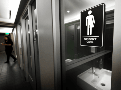 DURHAM, NC - MAY 10: Gender neutral signs are posted in the 21C Museum Hotel public restrooms on May 10, 2016 in Durham, North Carolina. Debate over transgender bathroom access spreads nationwide as the U.S. Department of Justice countersues North Carolina Governor Pat McCrory from enforcing the provisions of House …