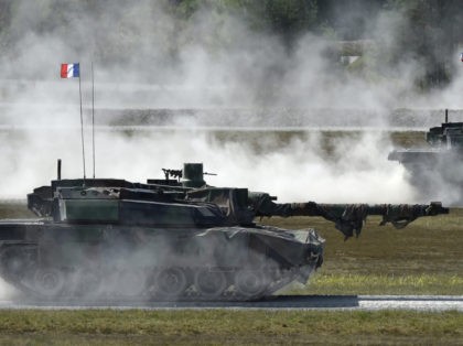 French army tanks type 'Leclerc' drive during a first shooting of the exercise 'Strong Europe Tank Challenge 2017' at the exercise area in Grafenwoehr, near Eschenbach, southern Germany, on May 11, 2017. Platoons from NATO nations France, Germany, USA and their partners Austria and Ukraine take part in this exercise. …