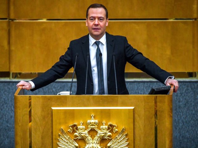 Russia's then-Prime Minister Dmitry Medvedev delivers a speech at the lower house of Russian parliament, the State Duma in Moscow on April 11, 2018. / AFP PHOTO / Yuri KADOBNOV (Photo credit should read YURI KADOBNOV/AFP via Getty Images)