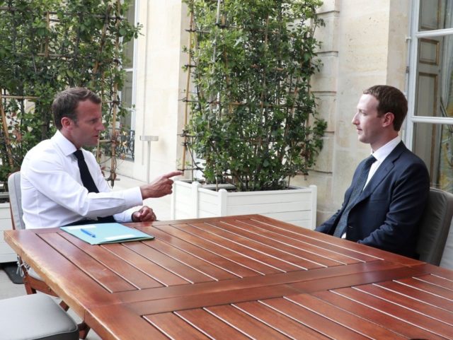 TOPSHOT - Facebook's CEO Mark Zuckerberg (R) meets with French President Emmanuel Macron (L) at the Elysee presidential palace after the "Tech for Good" summit in Paris on May 23, 2018. (Photo by CHRISTOPHE PETIT TESSON / POOL / AFP) (Photo credit should read CHRISTOPHE PETIT TESSON/AFP via Getty Images)