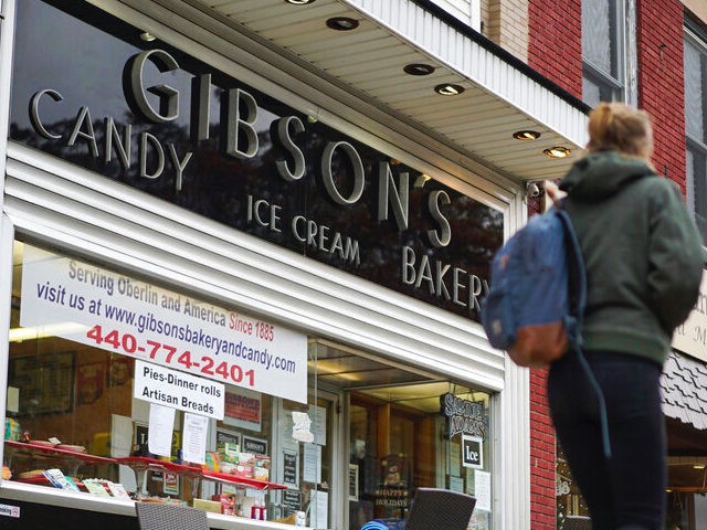 In this Nov. 22, 2017 file photo, pedestrians pass the storefront of Gibson's Bakery in Oberlin, Ohio. The 9th District Court of Appeals upheld a $31 million judgment on Thursday, March 31,, 2022 against Oberlin College that had been awarded to Gibson's Bakery and Food Mart that successfully claimed it …