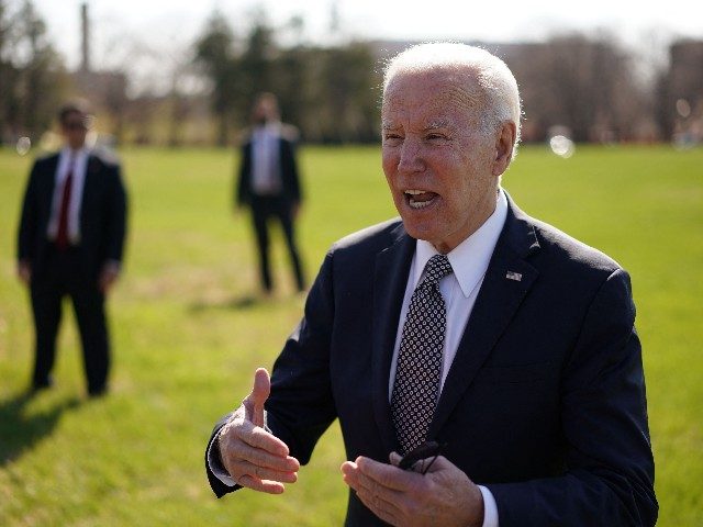 US President Joe Biden speaks to reporters upon arrival at Fort McNair in Washington, DC o