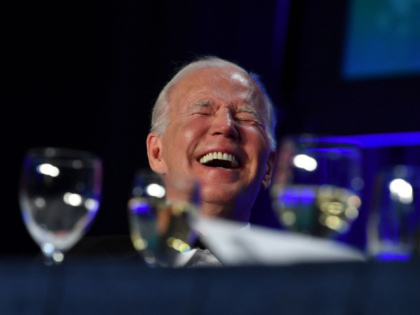 US President Joe Biden laughs during the White House Correspondents Association gala at the Washington Hilton Hotel in Washington, DC, on April 30, 2022. (Photo by Nicholas Kamm / AFP) (Photo by NICHOLAS KAMM/AFP via Getty Images)