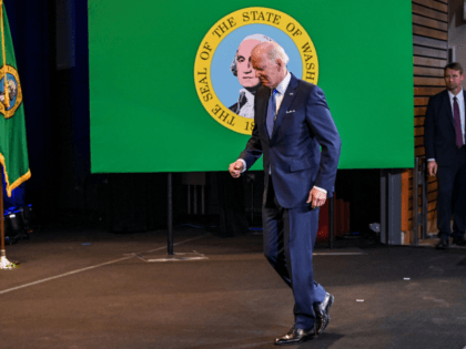 US President Joe Biden jogs off stage after speaking on lowering costs for consumers at Green River College in Auburn, Washington on April 22, 2022. - The President is reiterating the need to lower costs for families amid rising inflation. (Photo by MANDEL NGAN / AFP) (Photo by MANDEL NGAN/AFP …