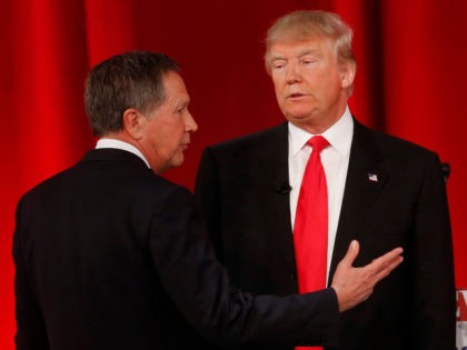Republican presidential candidate, Ohio Gov. John Kasich, left, speaks to Republican presidential candidate, businessman Donald Trump during a commercial break during the CBS News Republican presidential debate at the Peace Center, Saturday, Feb. 13, 2016, in Greenville, S.C. (AP Photo/John Bazemore)