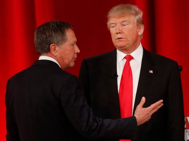 Republican presidential candidate, Ohio Gov. John Kasich, left, speaks to Republican presidential candidate, businessman Donald Trump during a commercial break during the CBS News Republican presidential debate at the Peace Center, Saturday, Feb. 13, 2016, in Greenville, S.C. (AP Photo/John Bazemore)