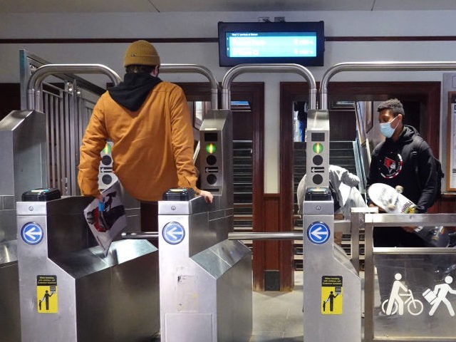 A passenger jumps the turnstile at at the entrance of an "L" station on November 09, 2021