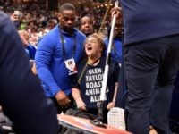Animal Rights Protester Chains Herself to Basket During NBA Game