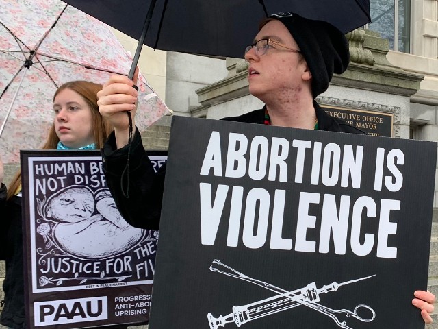 Left-wing pro-life activists, from the Progressive Anti-Abortion Union (PAAU), hold a rally outside the D.C. Mayor's Office in Washington, DC, April 7, 2022. (Matt Perdie/Breitbart News)