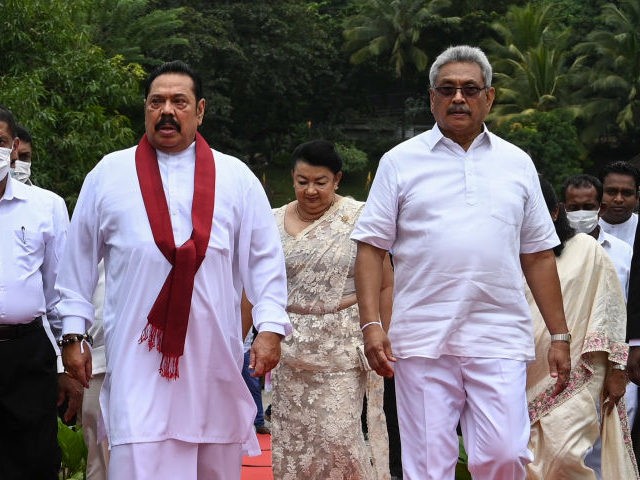 Sri Lanka's President Gotabaya Rajapakse (2R) and Prime Minister Mahinda Rajapakse (2L) le