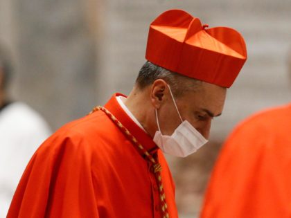 Newly-created Cardinal, Italian Mauro Gambetti (L), Custos of the Sacred Convent of Assisi, wearing his biretta hat, attends a Pope's consistory to create 13 new cardinals, on November 28, 2020 at St. Peter's Basilica in The Vatican. (Photo by FABIO FRUSTACI / POOL / AFP) (Photo by FABIO FRUSTACI/POOL/AFP via …
