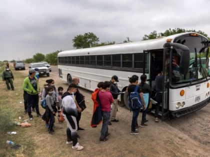 LA JOYA, Texas: Central American families board a U.S. Customs and Border Protection bus f