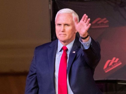 Former US Vice President Mike Pence waves as he arrives to speak at a campus lecture hosted by Young Americans for Freedom at the University of Virginia in Charlottesville, Virginia, on April 12, 2022. (RYAN M. KELLY/AFP via Getty Images)
