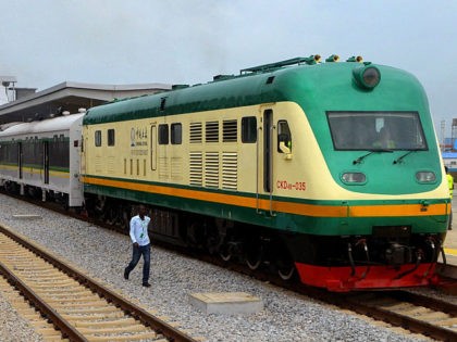 A man walks past a train of the newly completed Abuja-Kaduna night railway line in Abuja,